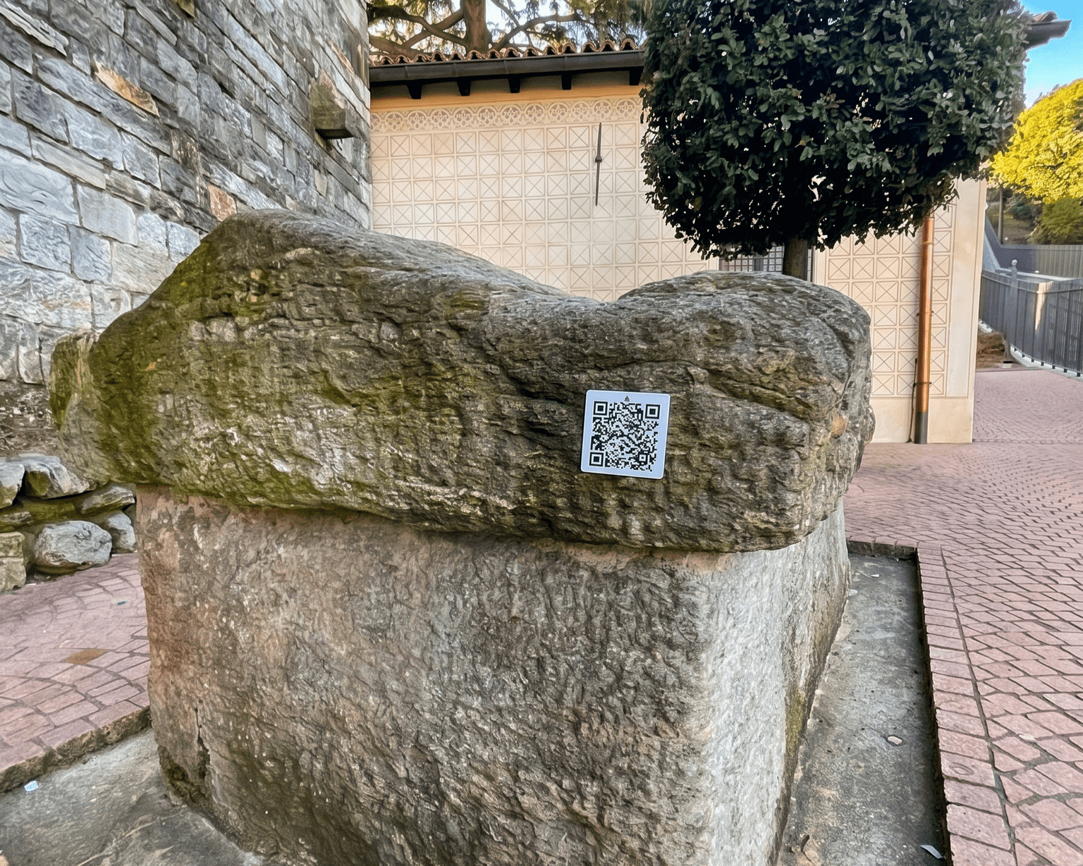 Memorial QR plaque placed on a stone surface