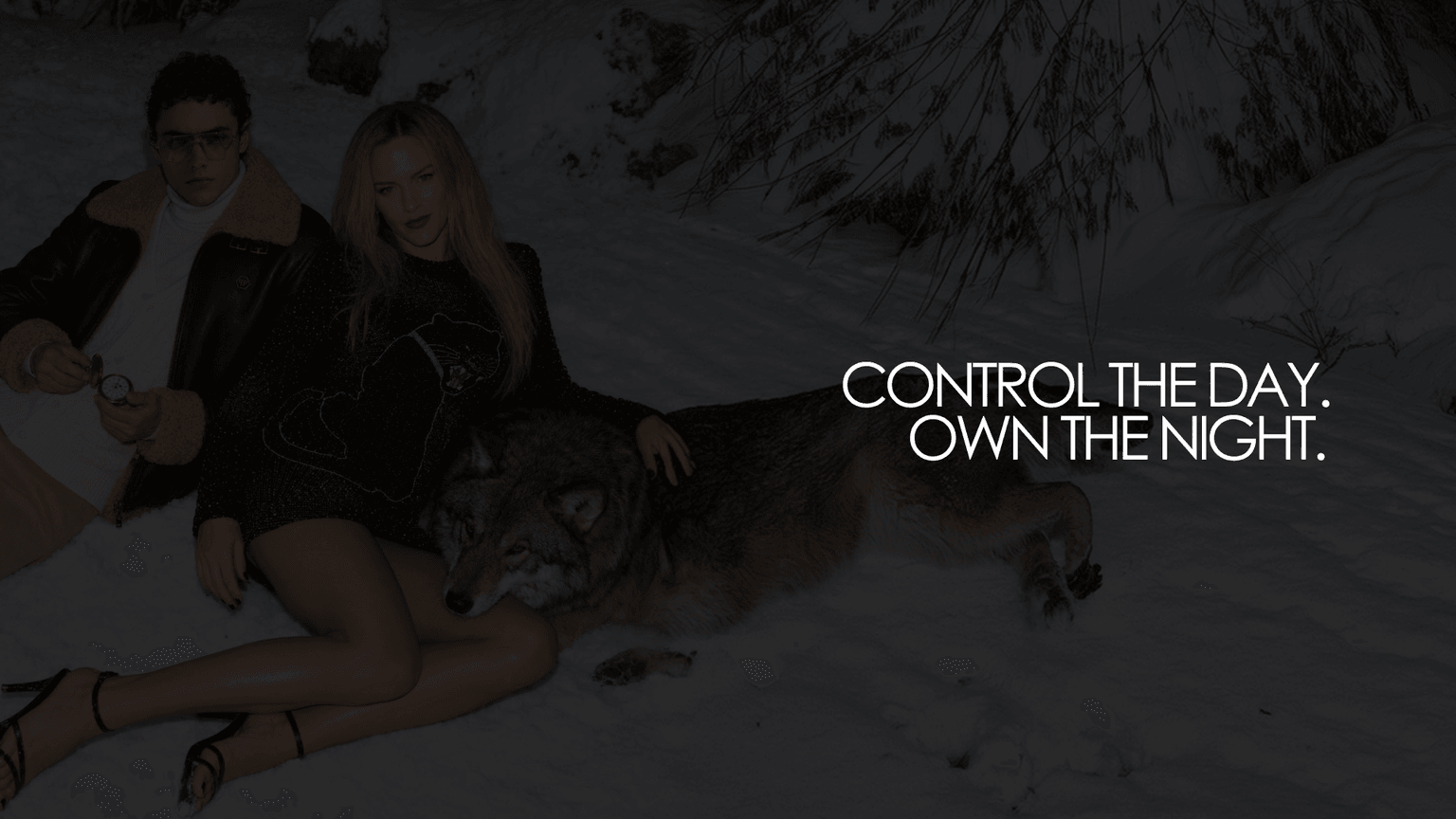 AI-generated campaign visual for the FW26 concept study, a couple and a wolf in the snow, with the tagline “Control the day. Own the night.”